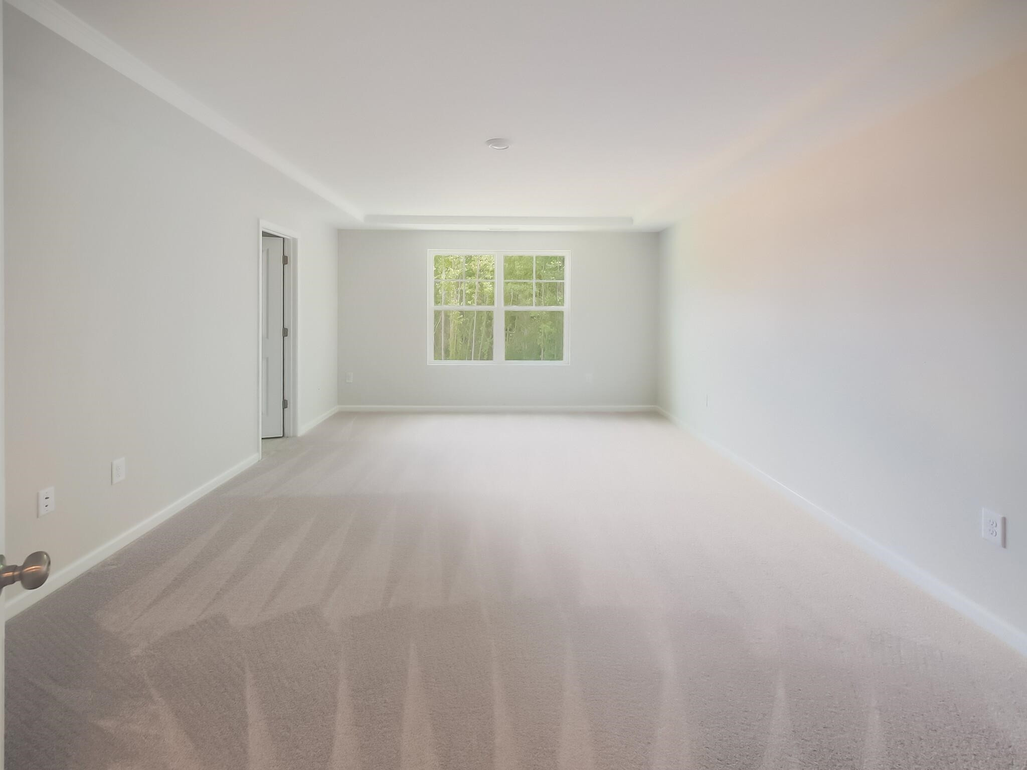1617 Emory Ridge Way Wake Forest, NC 27587 - Photo 14 of 24 a view of an empty room with a window