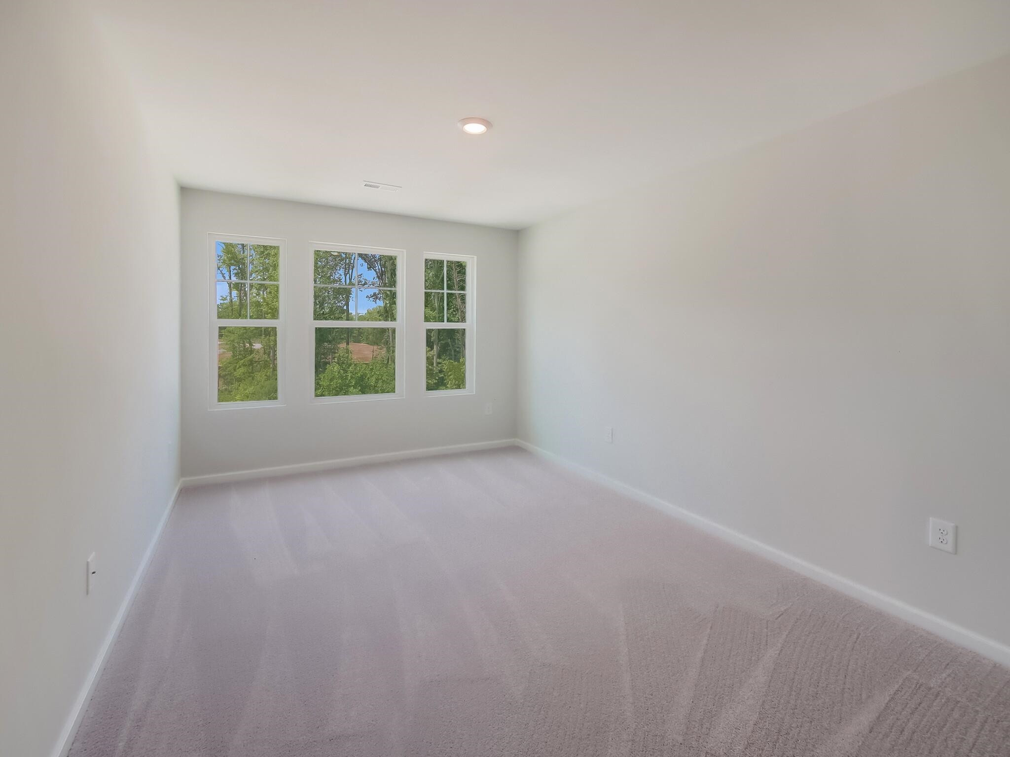 1617 Emory Ridge Way Wake Forest, NC 27587 - Photo 21 of 24 a view of an empty room with a window