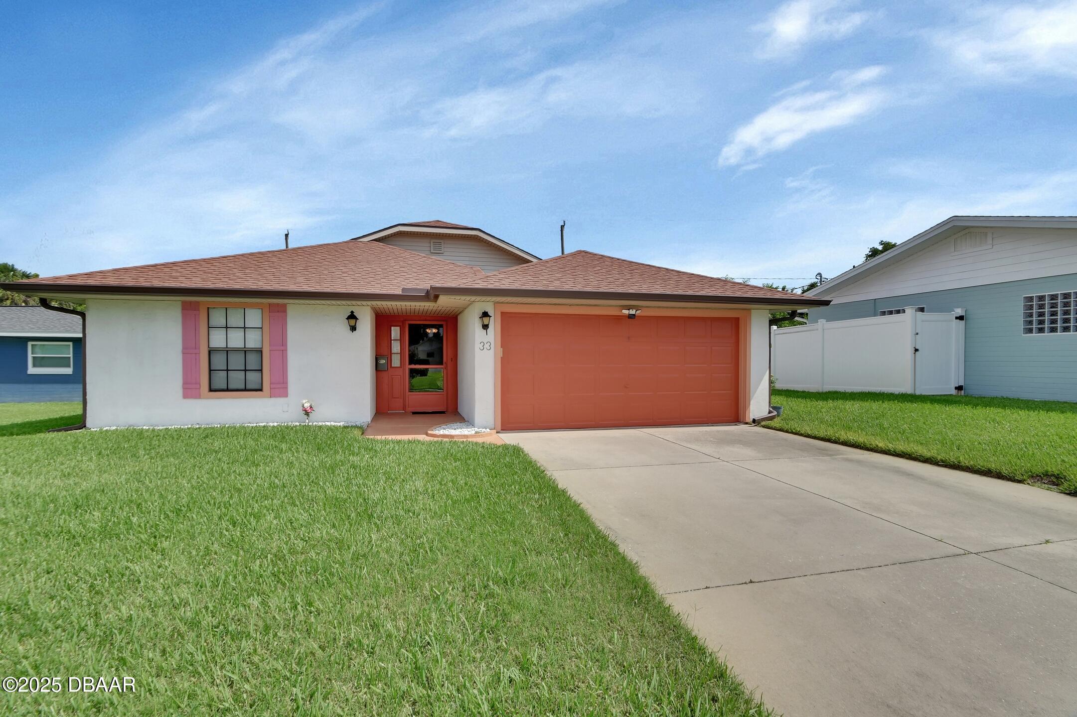 33 Rivocean Drive Ormond Beach, FL 32176 - Photo 1 of 29 a front view of a house with yard