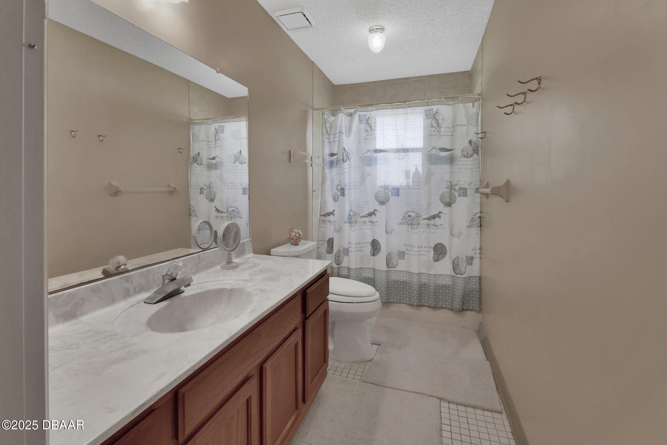 33 Rivocean Drive Ormond Beach, FL 32176 - Photo 11 of 29 a bathroom with a sink a toilet and shower
