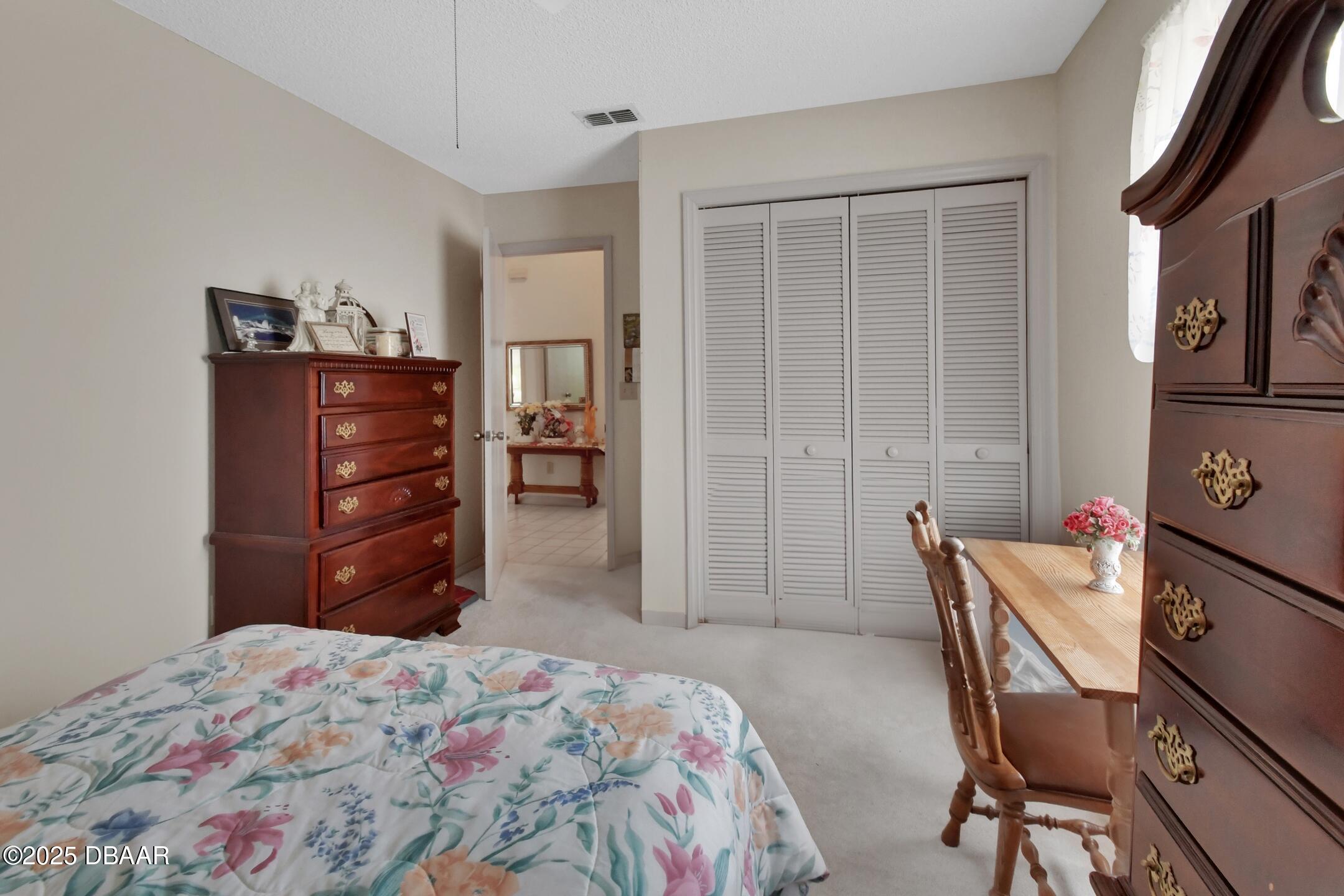 33 Rivocean Drive Ormond Beach, FL 32176 - Photo 13 of 29 a bedroom with a bed and furniture
