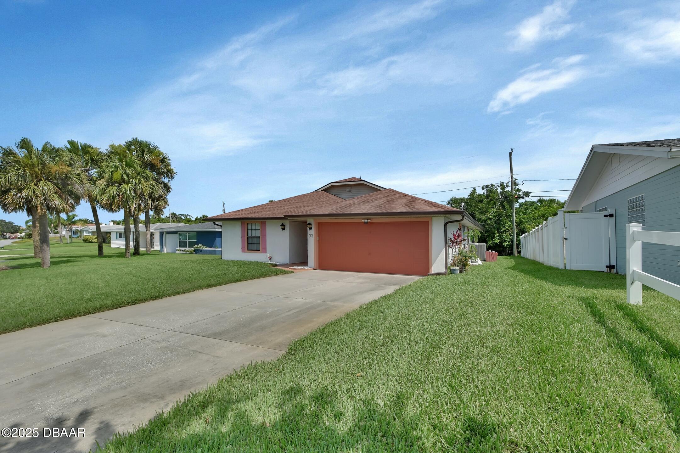 33 Rivocean Drive Ormond Beach, FL 32176 - Photo 18 of 29 a front view of a house with garden