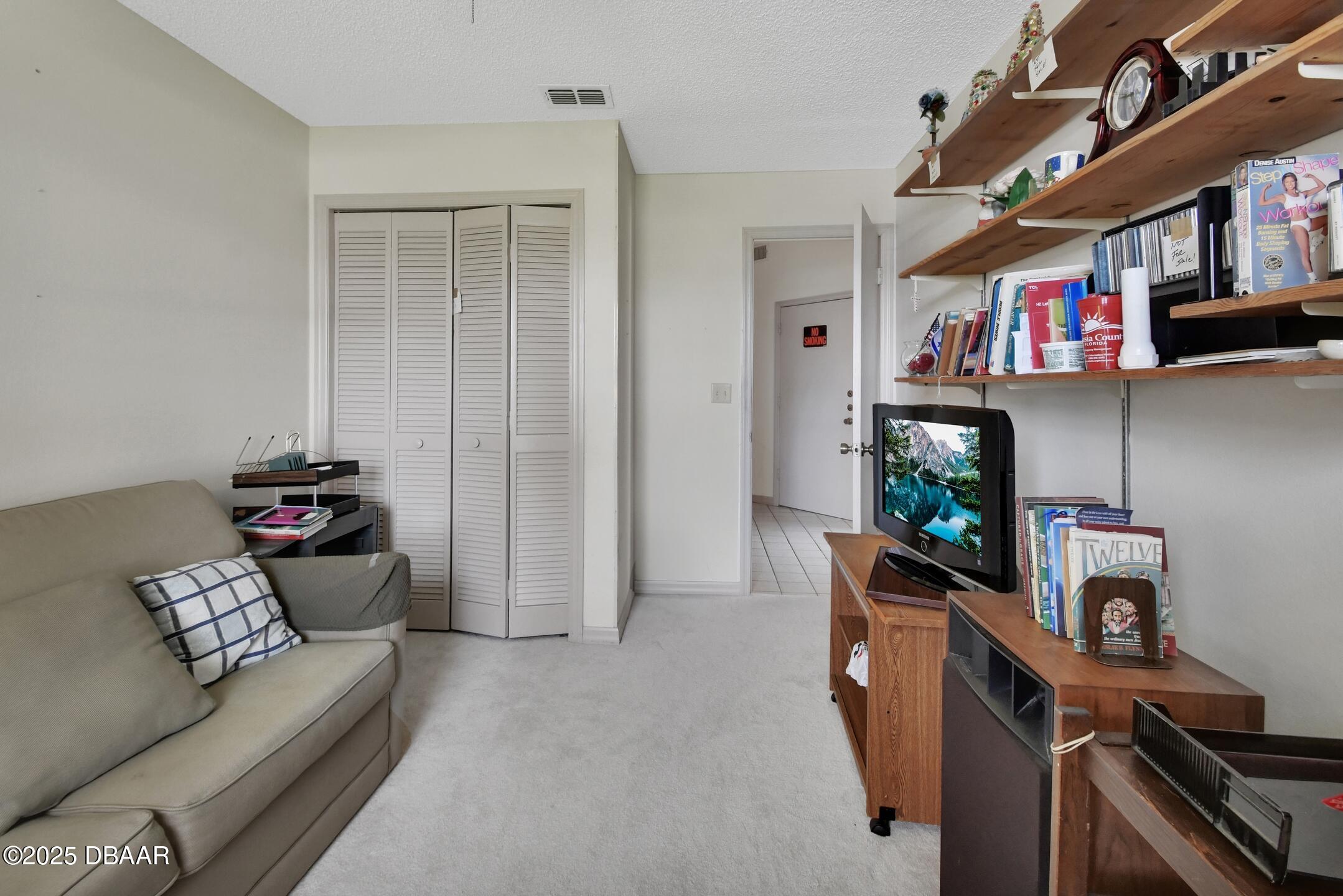 33 Rivocean Drive Ormond Beach, FL 32176 - Photo 10 of 29 a living room with furniture and a flat screen tv