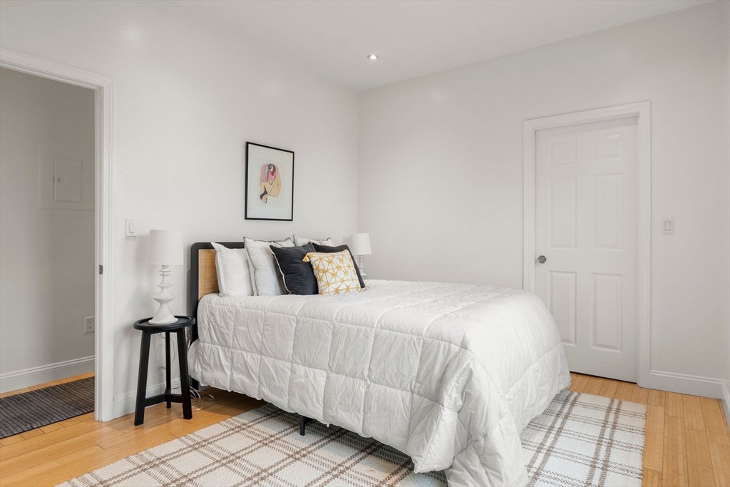 178 Hyde Park Avenue, Unit 3 Boston, MA 02130 - Photo 12 of 23 a bedroom with a bed and a window