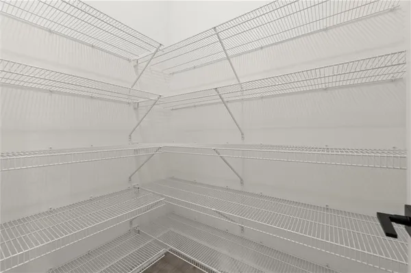 a view of a room with racks on the wall