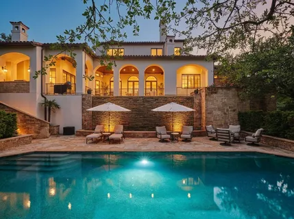 an outdoor space with pool and furniture