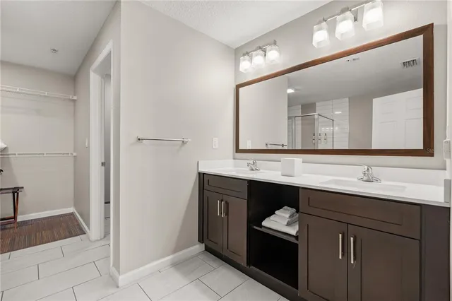 a bathroom with a shower and a mirror