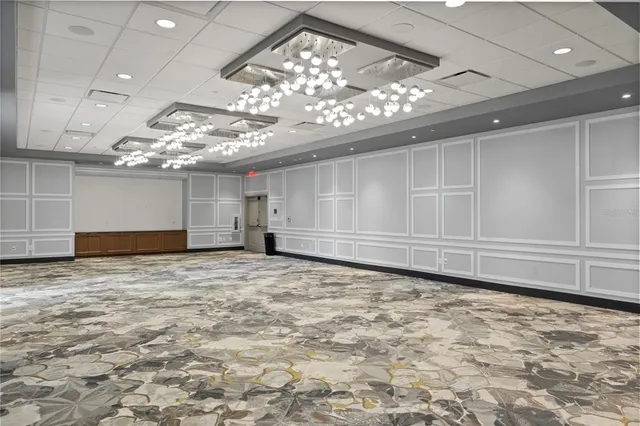 a view of living room with furniture and chandelier