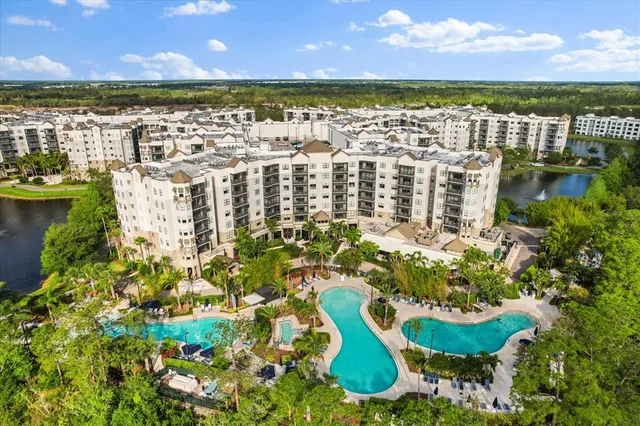 a view of a brick building next to a yard