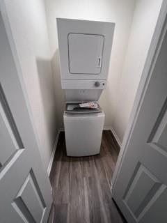 807 South 6th Street, Unit 3 Bonham, TX 75418 - Photo 5 of 8 Laundry area featuring dark wood-type flooring and estacked washer and dryer