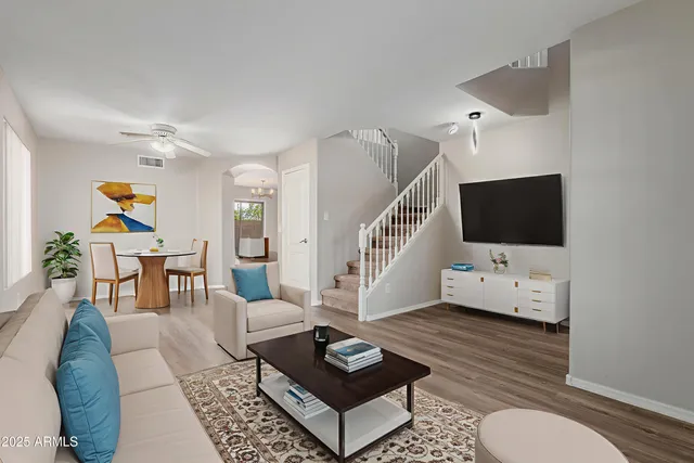 a living room with furniture and a flat screen tv