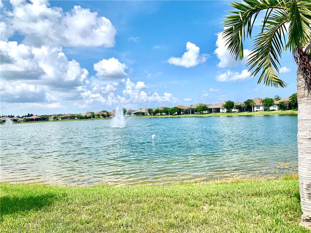 14632 Edgewater Circle Naples, FL 34114 - Photo 1 of 35 a view of a lake and a houses