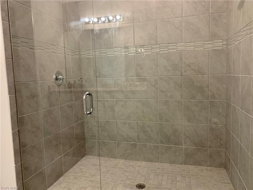 14632 Edgewater Circle Naples, FL 34114 - Photo 18 of 35 a bathroom with a shower