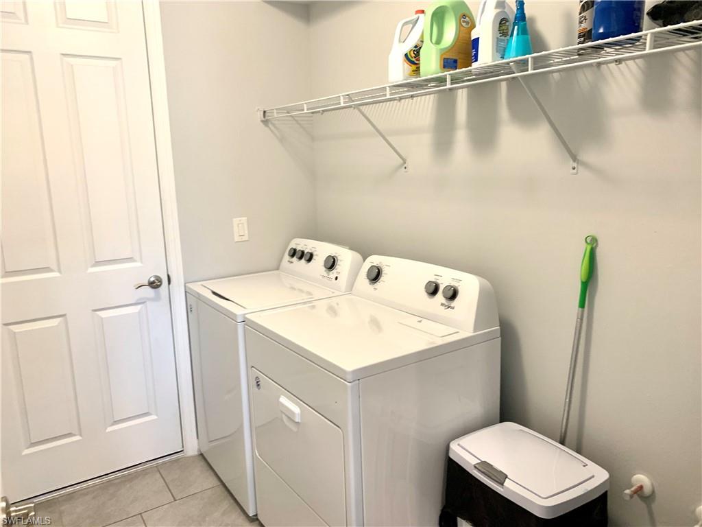 14632 Edgewater Circle Naples, FL 34114 - Photo 25 of 35 a utility room with dryer and washer