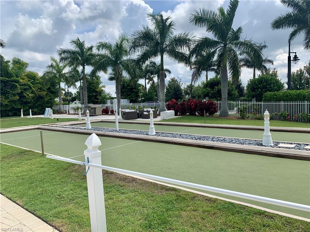 14632 Edgewater Circle Naples, FL 34114 - Photo 35 of 35 a house view with a swimming pool and sitting space