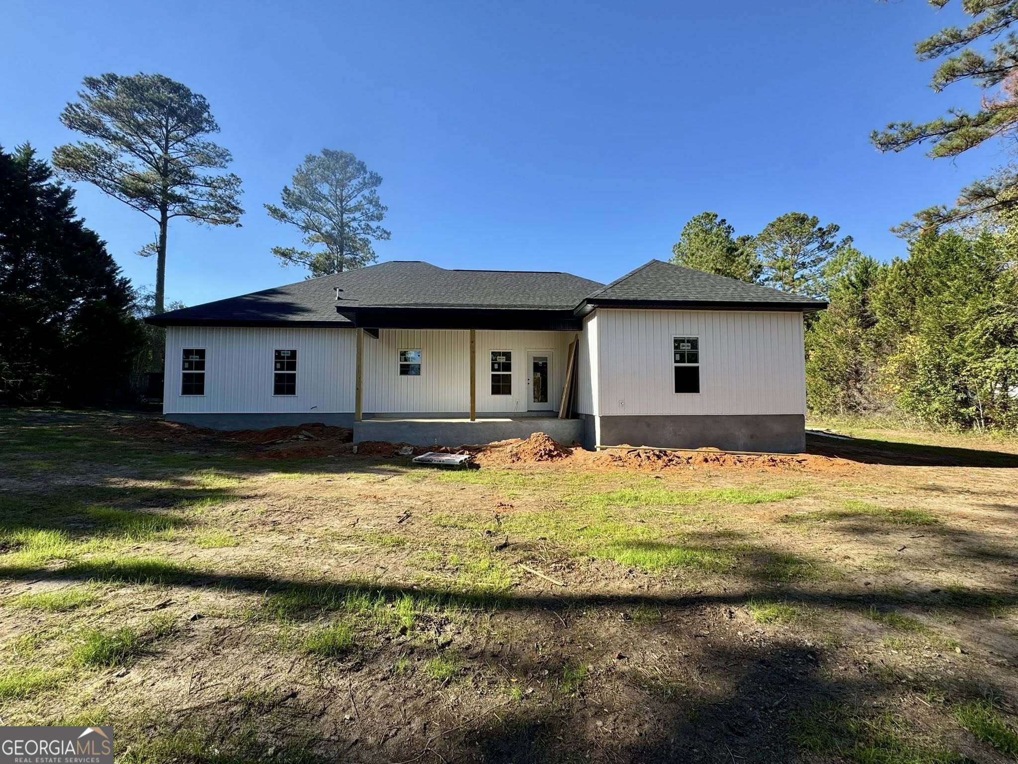 230 Woodland Heights Road Dublin, GA 31021 - Photo 28 of 30 a house view with a swimming pool in front of it