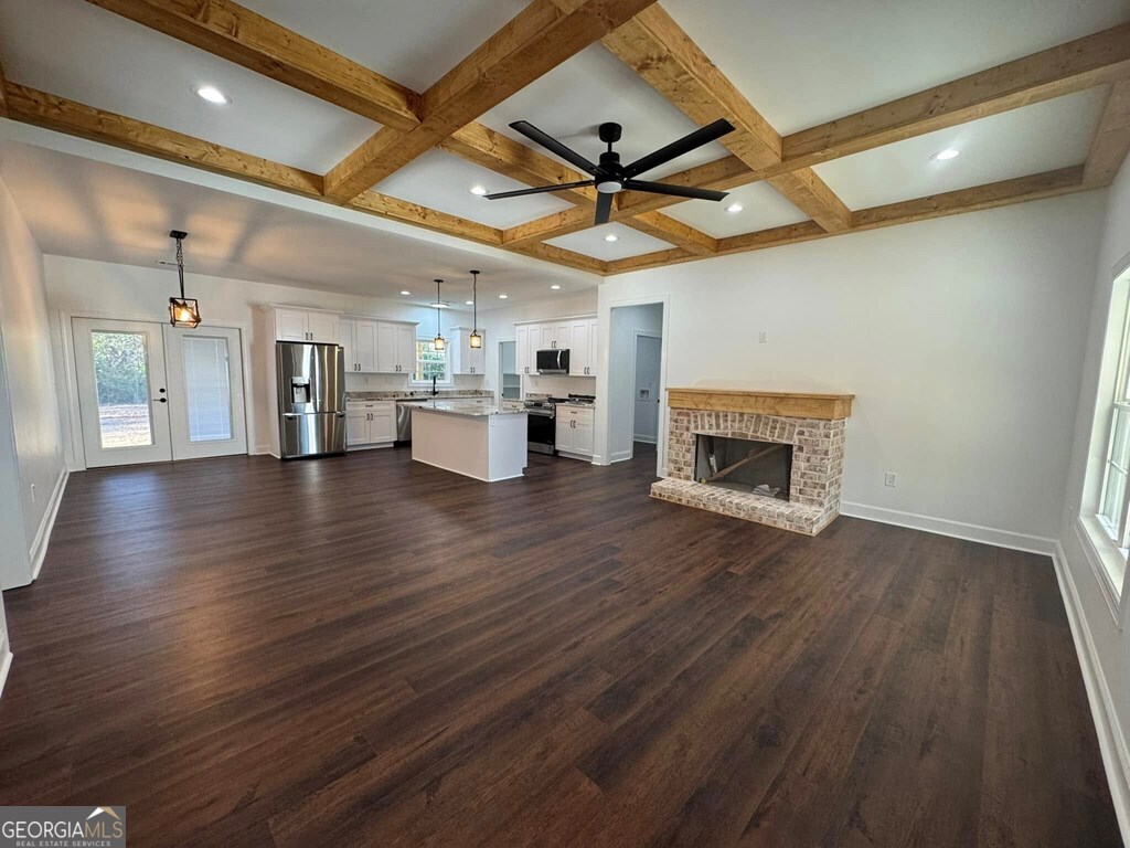 230 Woodland Heights Road Dublin, GA 31021 - Photo 3 of 30 a view of empty room with wooden floor and fireplace