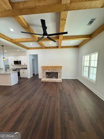 a view of a livingroom with wooden floor