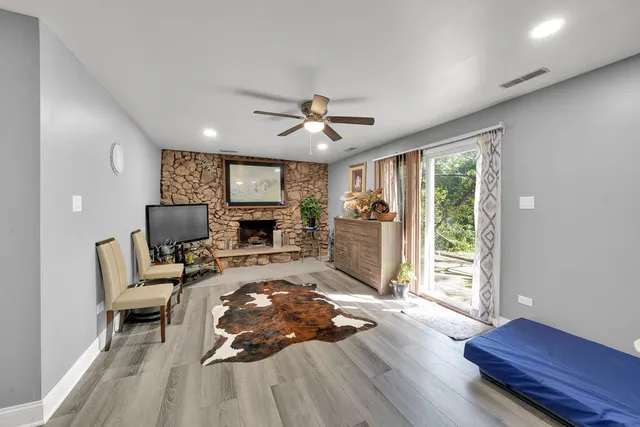 a bathroom with a toilet sink vanity and mirror