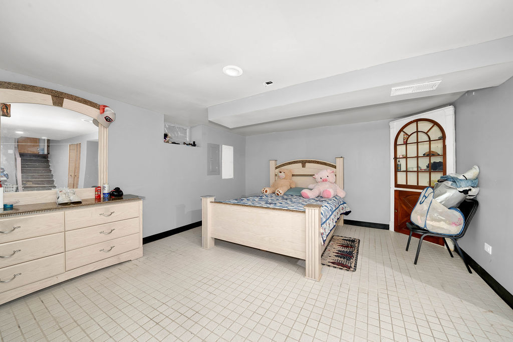 7245 West Dralle Road Monee, IL 60449 - Photo 18 of 73 a bed room with a bed and a chair