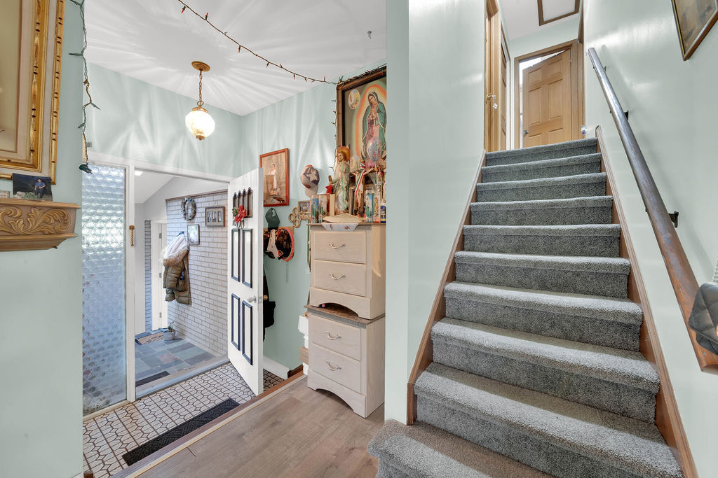 7245 West Dralle Road Monee, IL 60449 - Photo 23 of 73 a view of a hallway with wooden floor and staircase