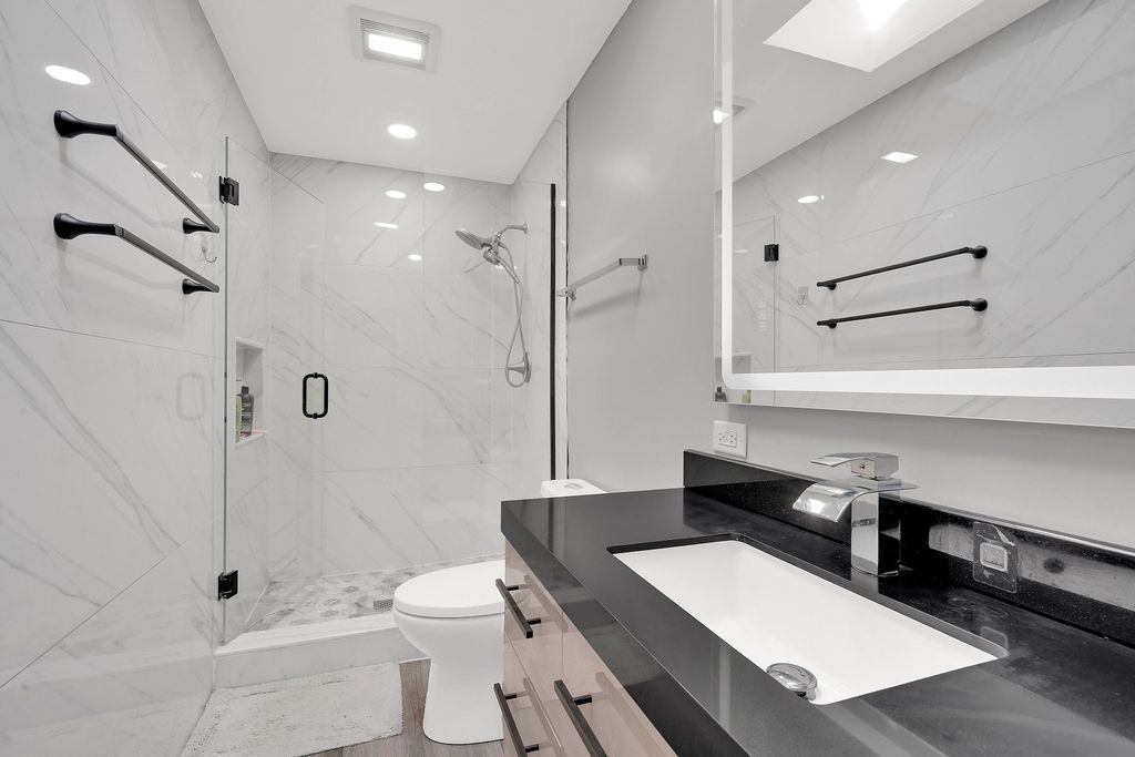 7245 West Dralle Road Monee, IL 60449 - Photo 29 of 73 a bathroom with a toilet a sink and a shower