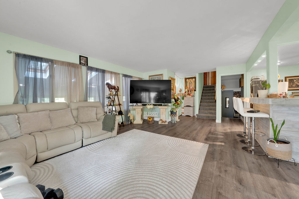 7245 West Dralle Road Monee, IL 60449 - Photo 3 of 73 a living room with furniture and a flat screen tv