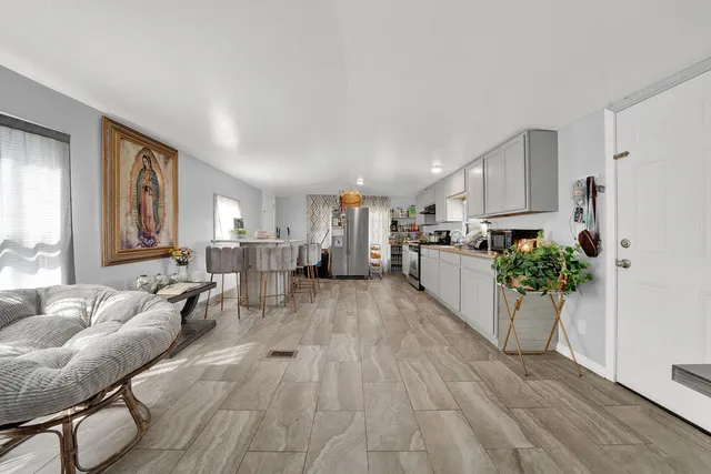 a view of backyard with a table and chairs