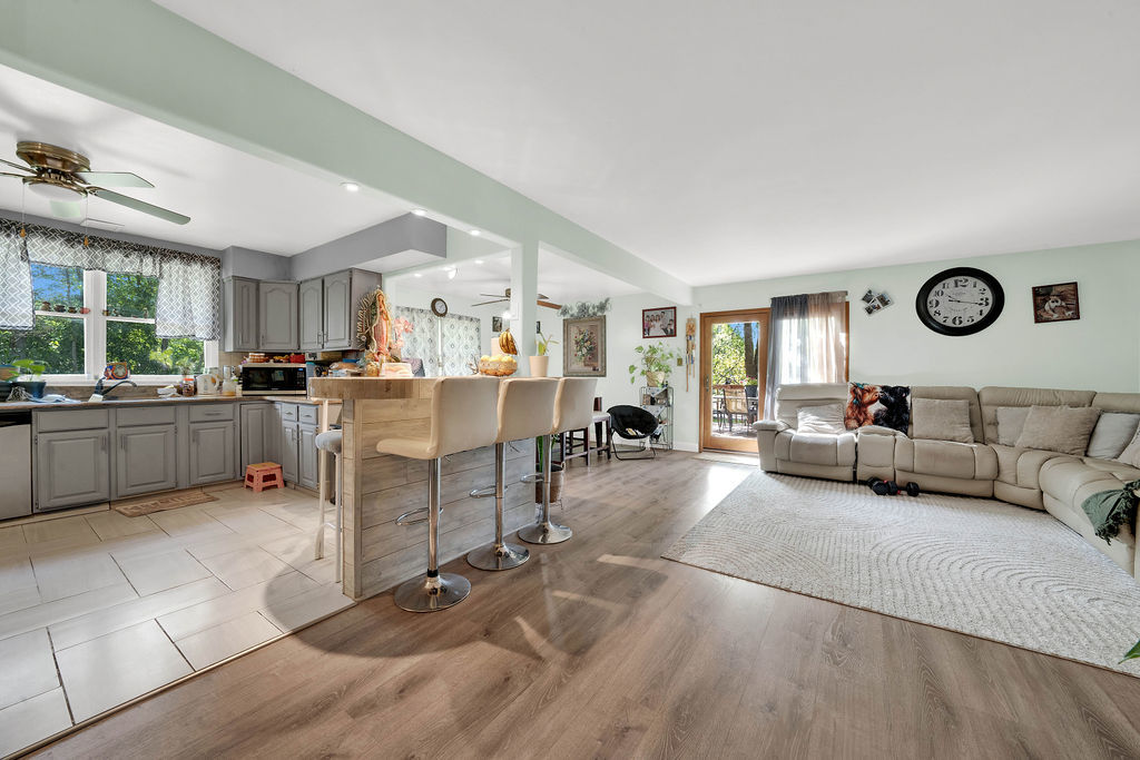 7245 West Dralle Road Monee, IL 60449 - Photo 4 of 73 a living room with furniture and a clock