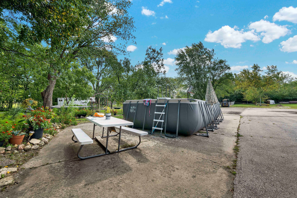 7245 West Dralle Road Monee, IL 60449 - Photo 47 of 73 a view of backyard with a table and chairs