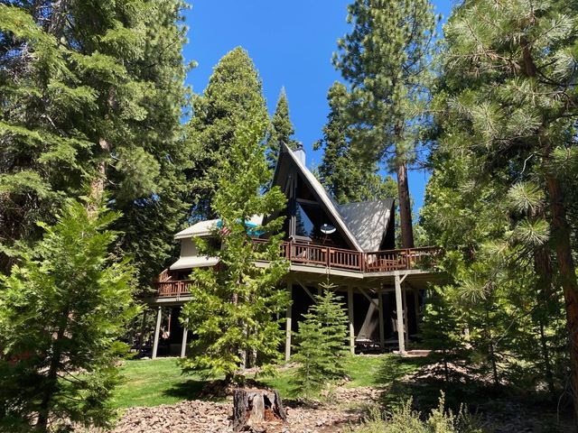 573 Granite Road Carnelian Bay, CA 96140 - Photo 2 of 21 a front view of a house with a garden