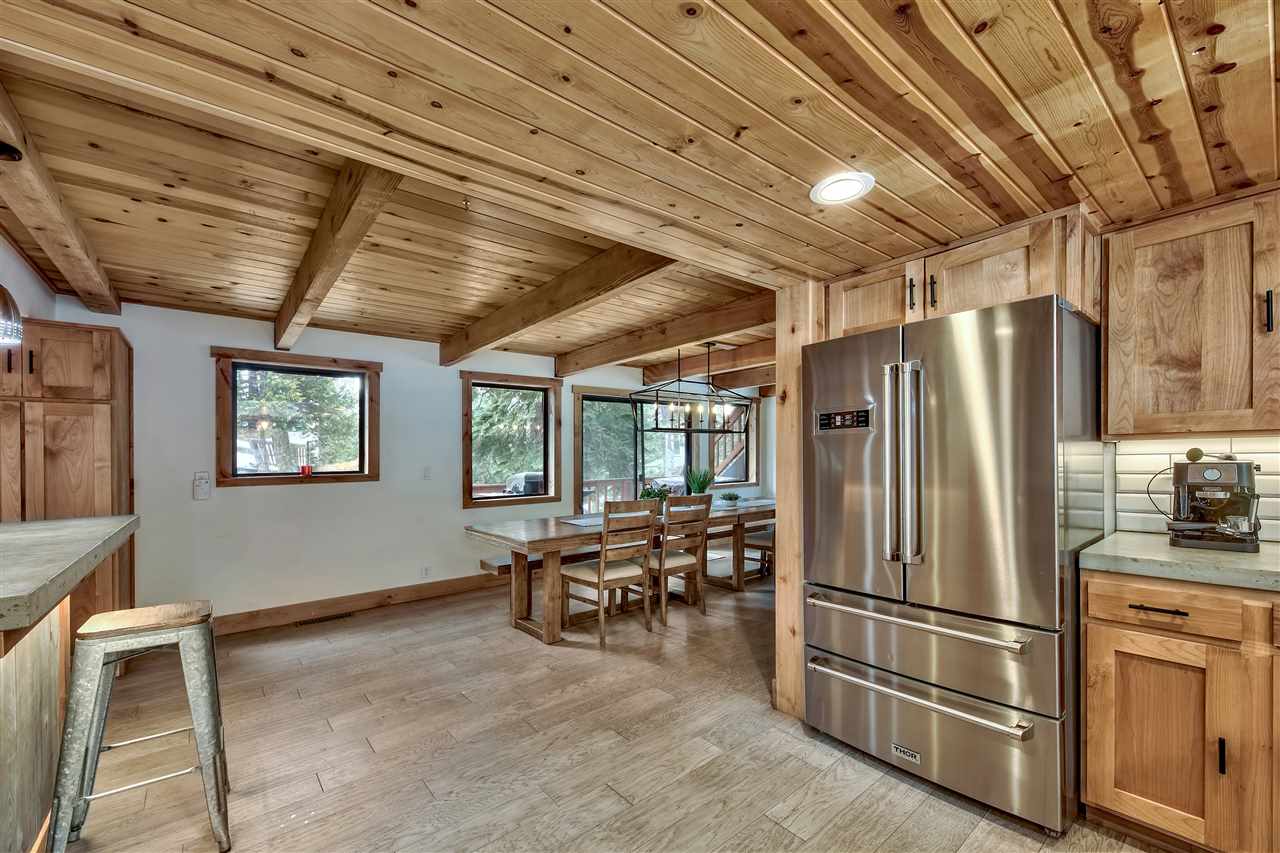 573 Granite Road Carnelian Bay, CA 96140 - Photo 11 of 21 a kitchen with stainless steel appliances a refrigerator and wooden cabinets