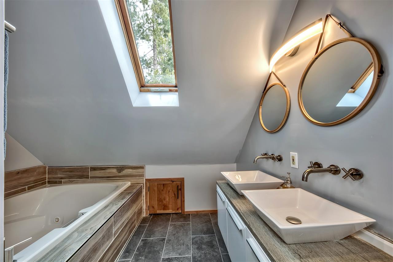573 Granite Road Carnelian Bay, CA 96140 - Photo 15 of 21 a bathroom with a sink and a mirror