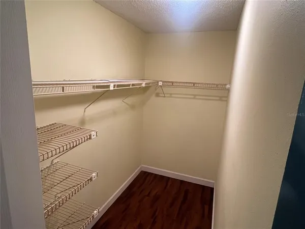a view of a room with racks on the wall