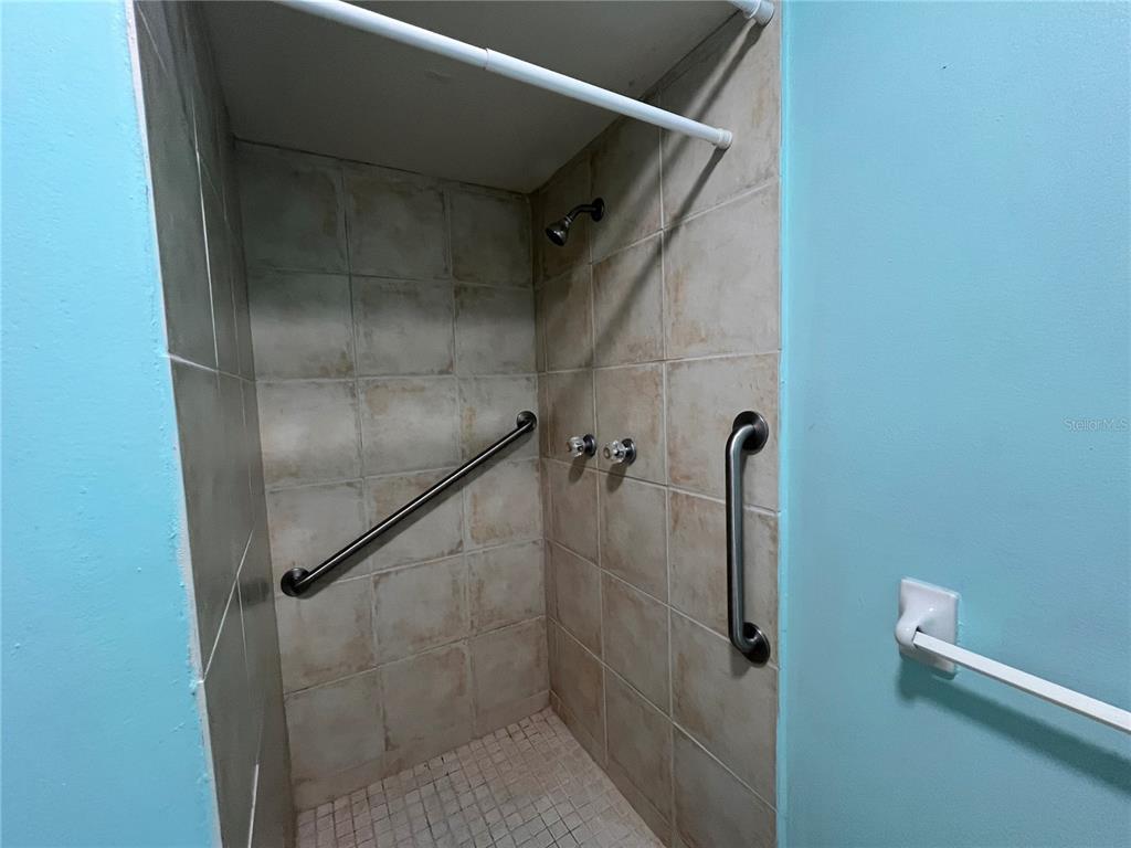 11718 Bayonet Lane, Unit A New Port Richey, FL 34654 - Photo 16 of 41 a bathroom with a shower