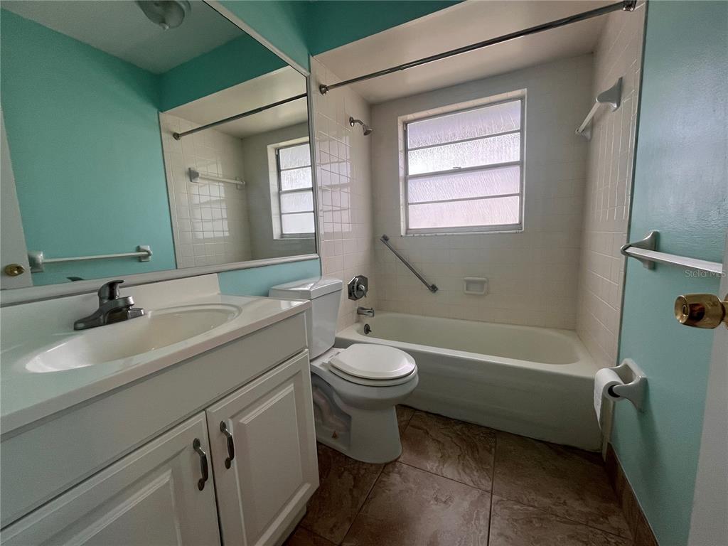 11718 Bayonet Lane, Unit A New Port Richey, FL 34654 - Photo 19 of 41 a bathroom with a sink a toilet and a bathtub