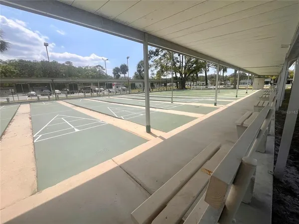 a view of a swimming pool with an outdoor seating