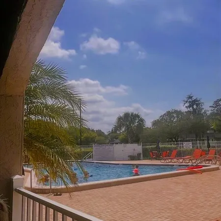 a view of swimming pool with a yard and sitting area