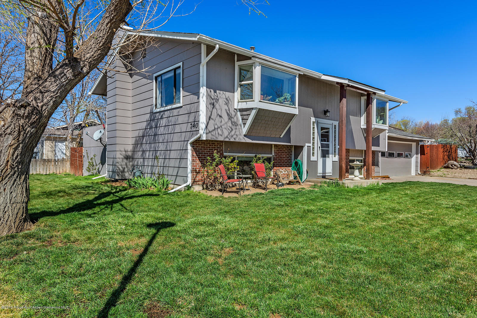 740 East 5th Street Rifle, CO 81650 - Photo 1 of 21 a view of a house with a backyard