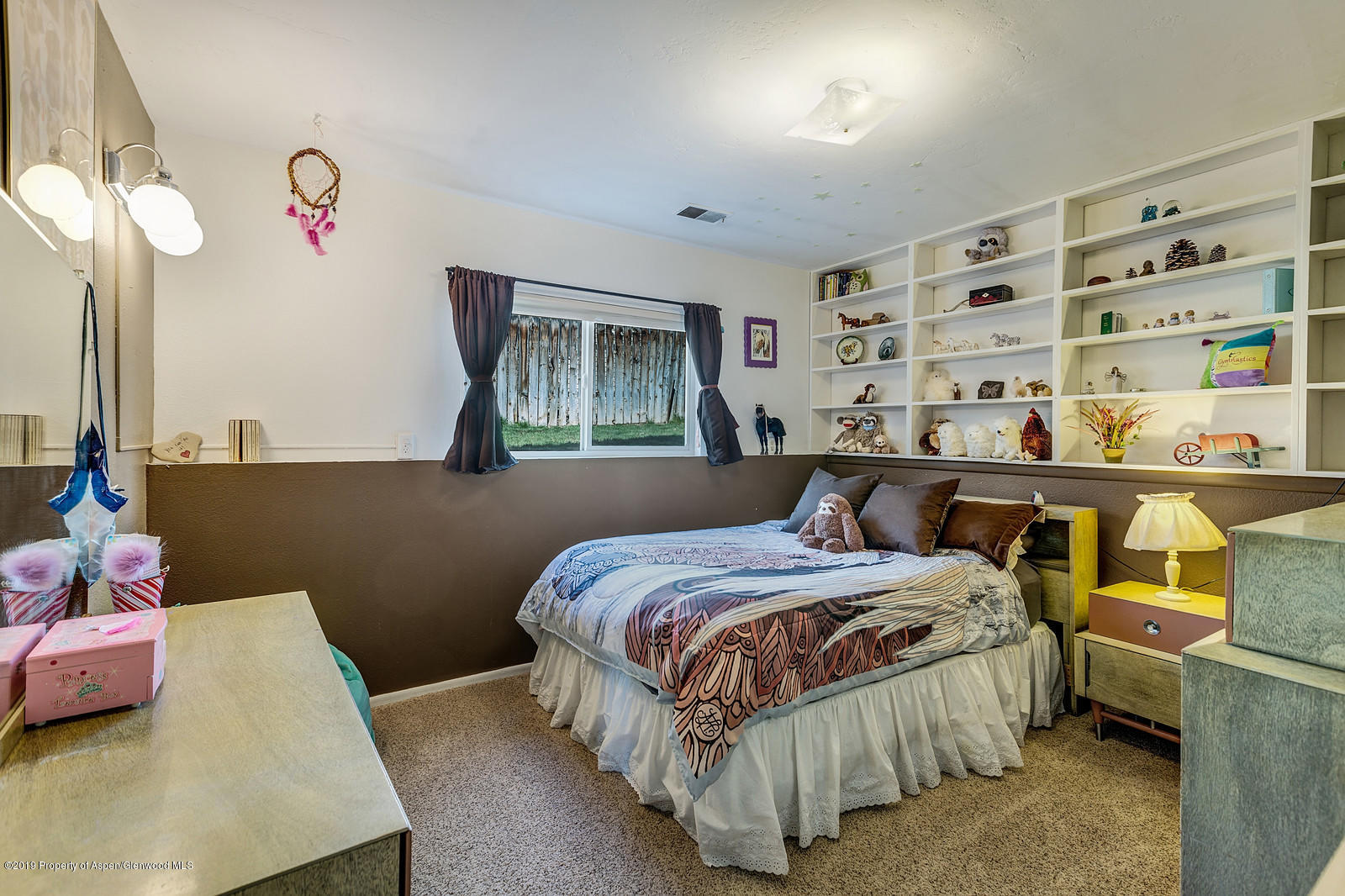 740 East 5th Street Rifle, CO 81650 - Photo 18 of 21 a bedroom with a bed and window