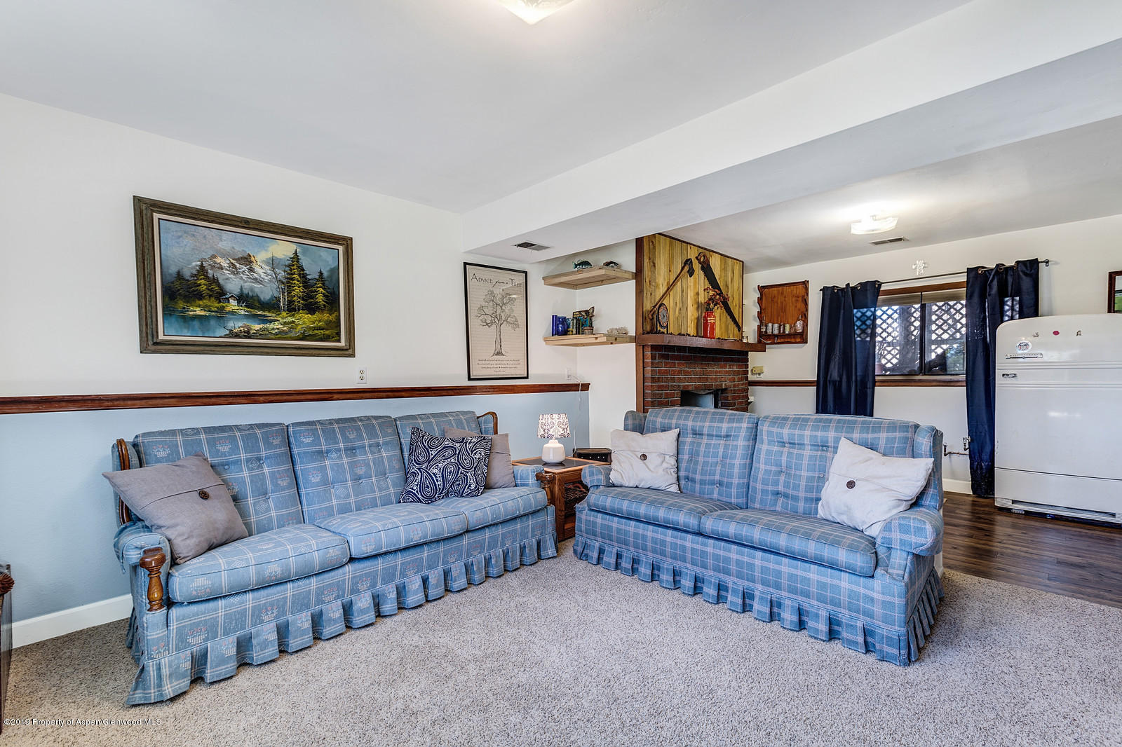 740 East 5th Street Rifle, CO 81650 - Photo 20 of 21 a living room with furniture and a couch