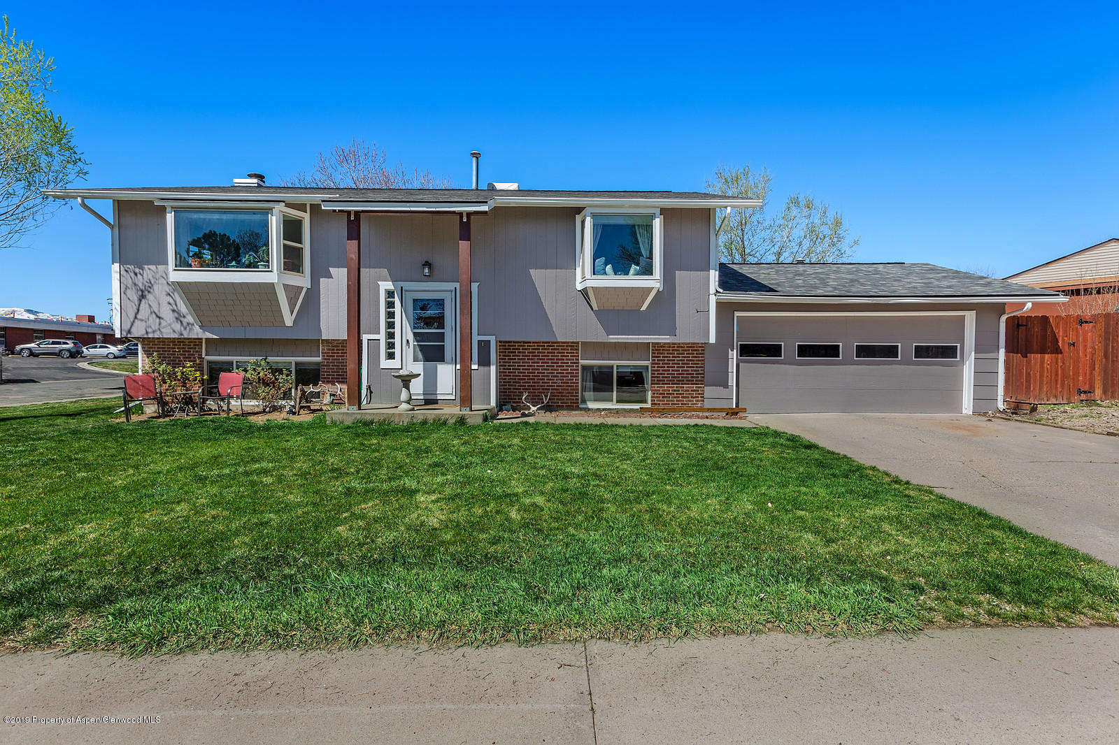 740 East 5th Street Rifle, CO 81650 - Photo 2 of 21 a view of a house with backyard and porch