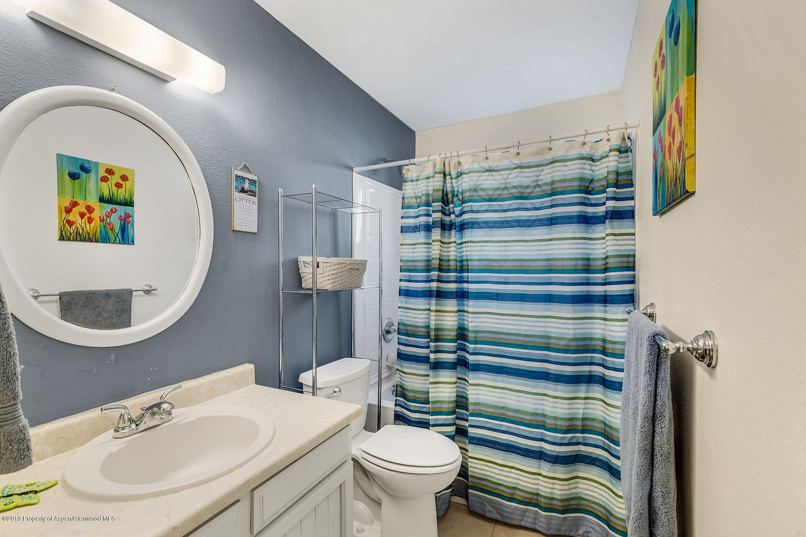 740 East 5th Street Rifle, CO 81650 - Photo 21 of 21 a bathroom with a sink a toilet and a mirror