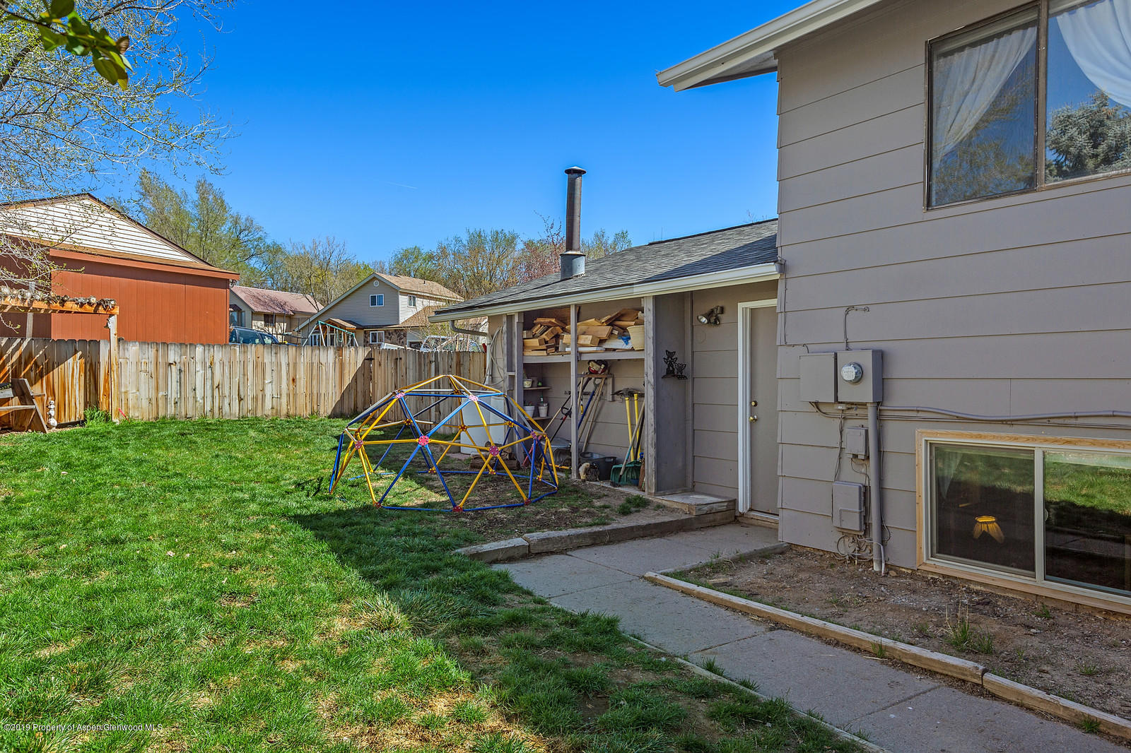 740 East 5th Street Rifle, CO 81650 - Photo 4 of 21 a view of a house with backyard