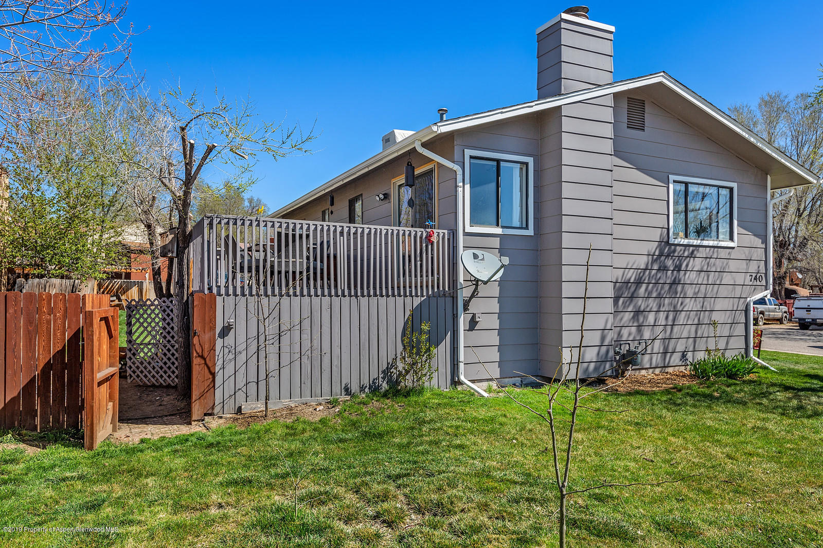 740 East 5th Street Rifle, CO 81650 - Photo 6 of 21 a view of a house with wooden fence