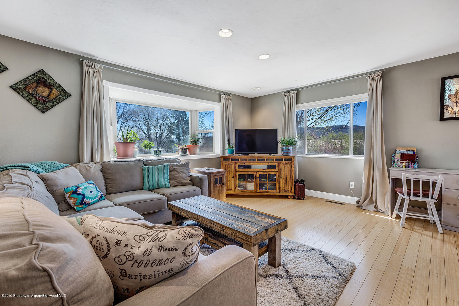 740 East 5th Street Rifle, CO 81650 - Photo 7 of 21 a living room with furniture and a flat screen tv