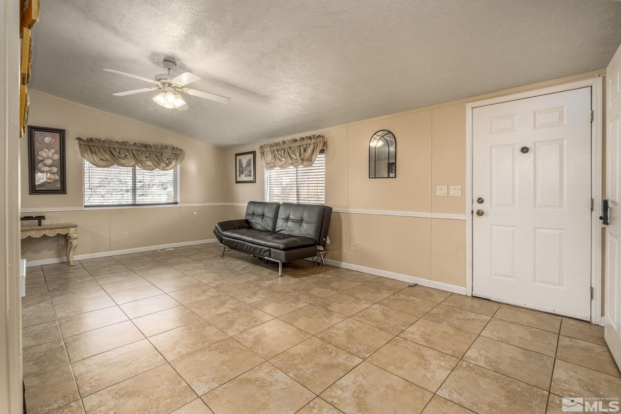 1670 Rockchuck Road Reno, NV 89506 - Photo 13 of 31 a living room with furniture and a window