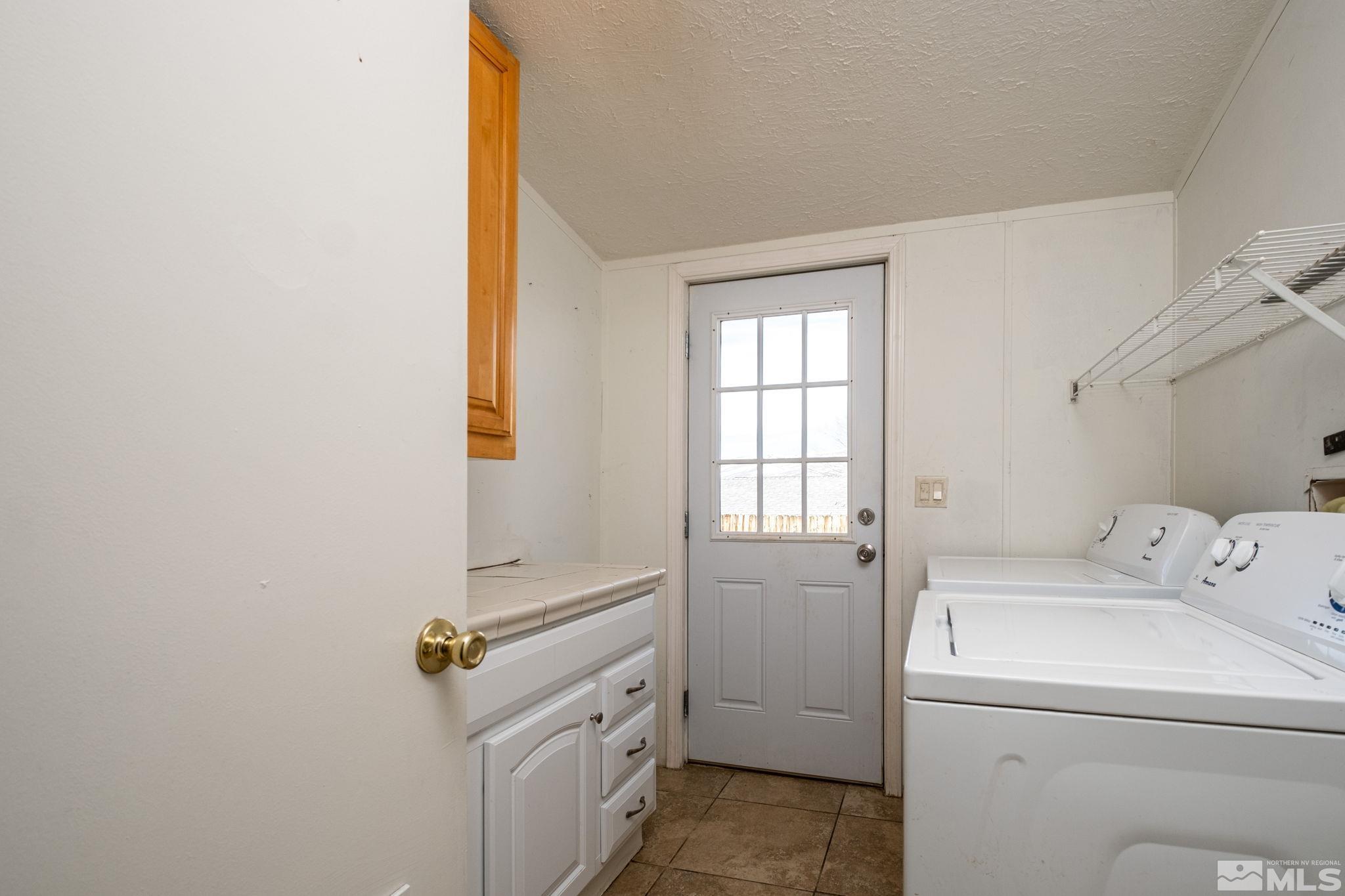 1670 Rockchuck Road Reno, NV 89506 - Photo 15 of 31 a room with storage and utility