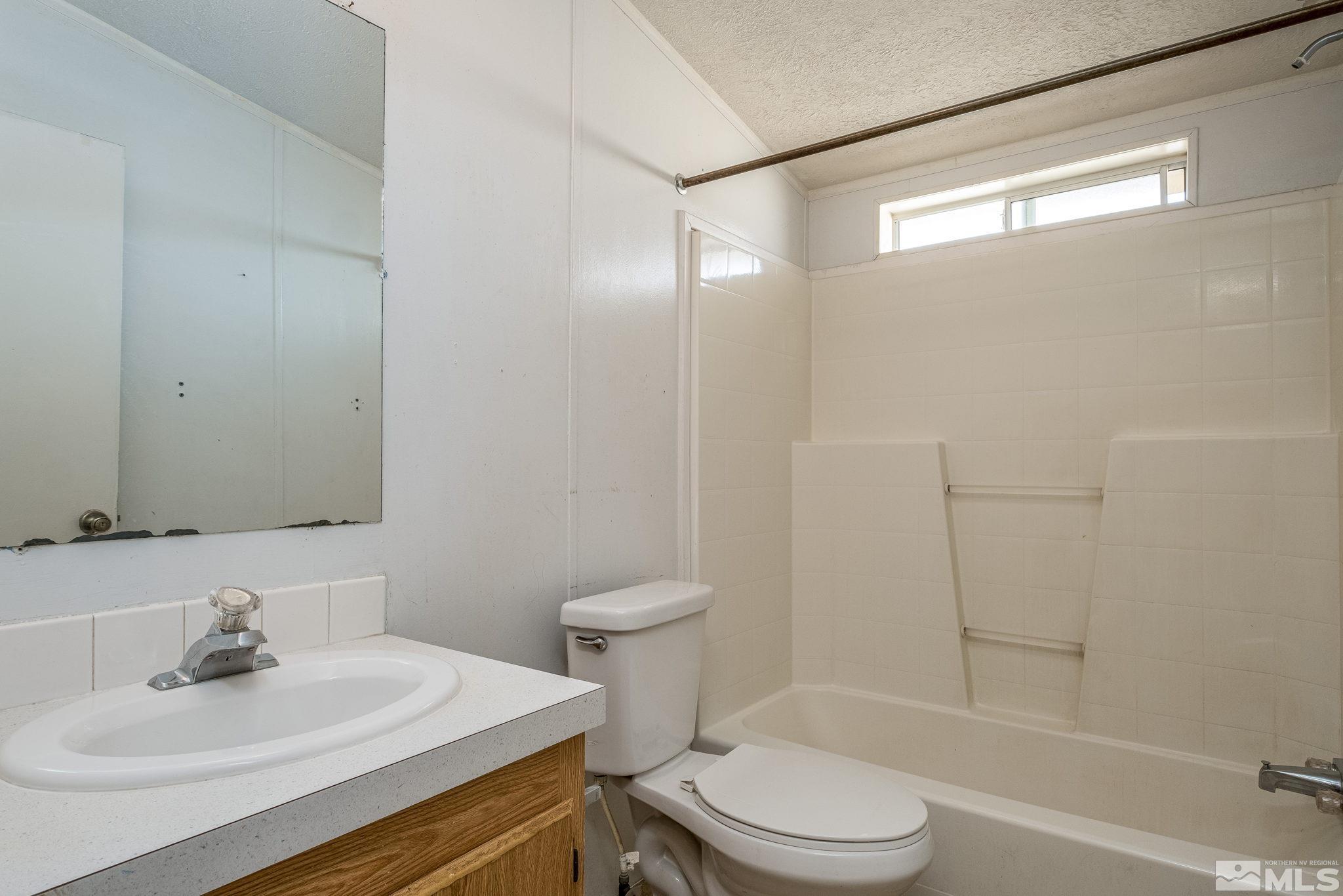 1670 Rockchuck Road Reno, NV 89506 - Photo 16 of 31 a bathroom with a sink toilet and shower
