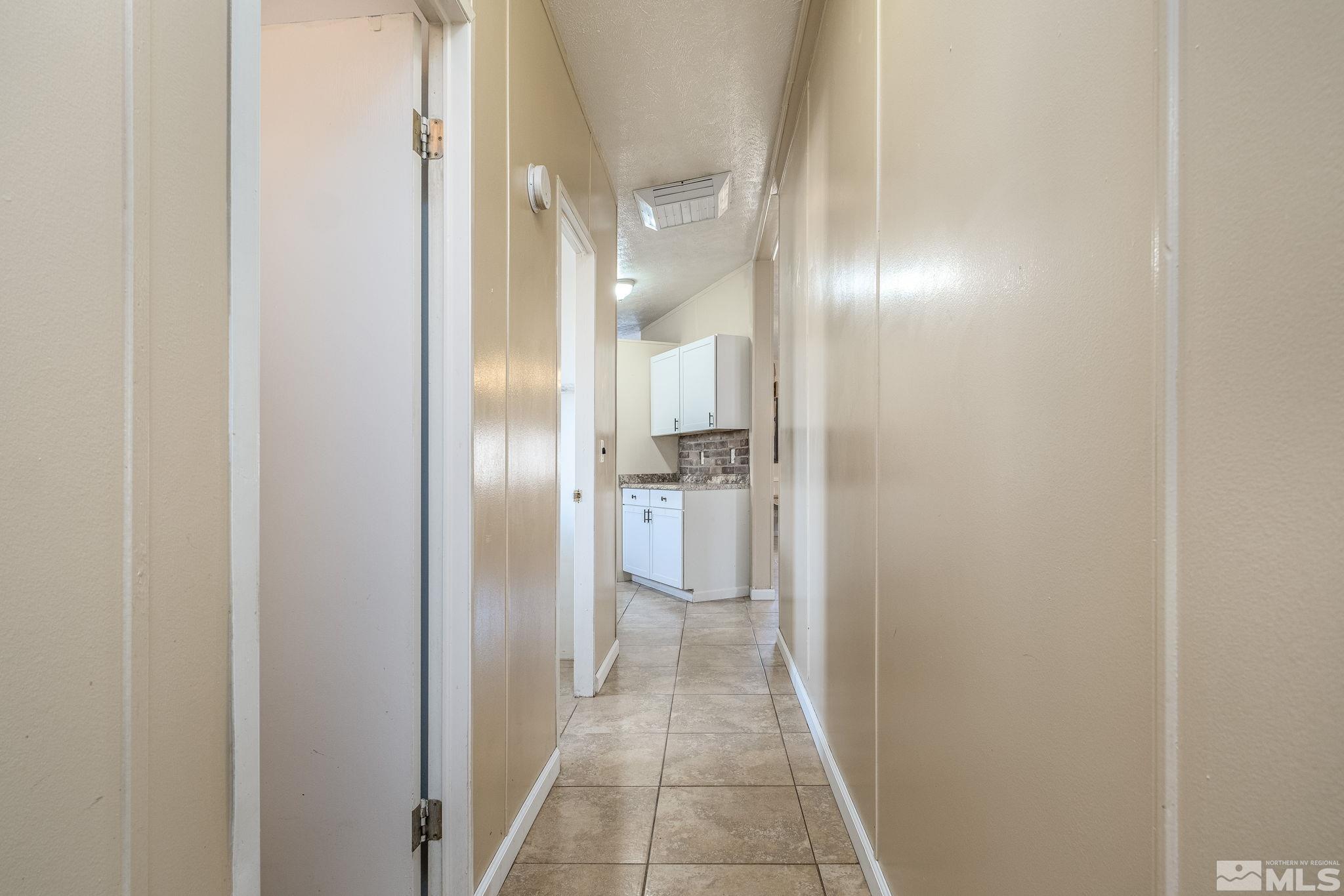 1670 Rockchuck Road Reno, NV 89506 - Photo 22 of 31 a view of a hallway